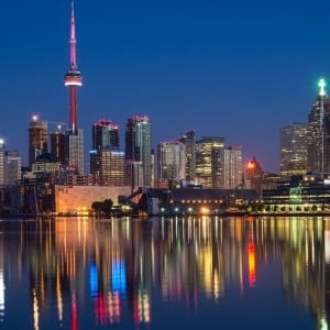buildings near body of water at night