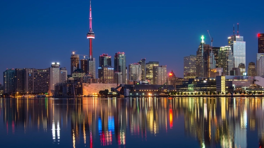 buildings near body of water at night